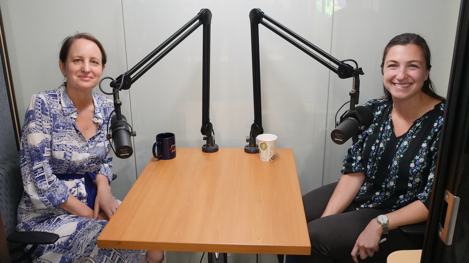 Sophia Rosenfeld sits at desk with microphone with Stephanie Perry, also seated at the desk with microphone.