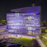 Vagelos Laboratory for Energy Science and Technology illuminated in blue, purple, and white lights