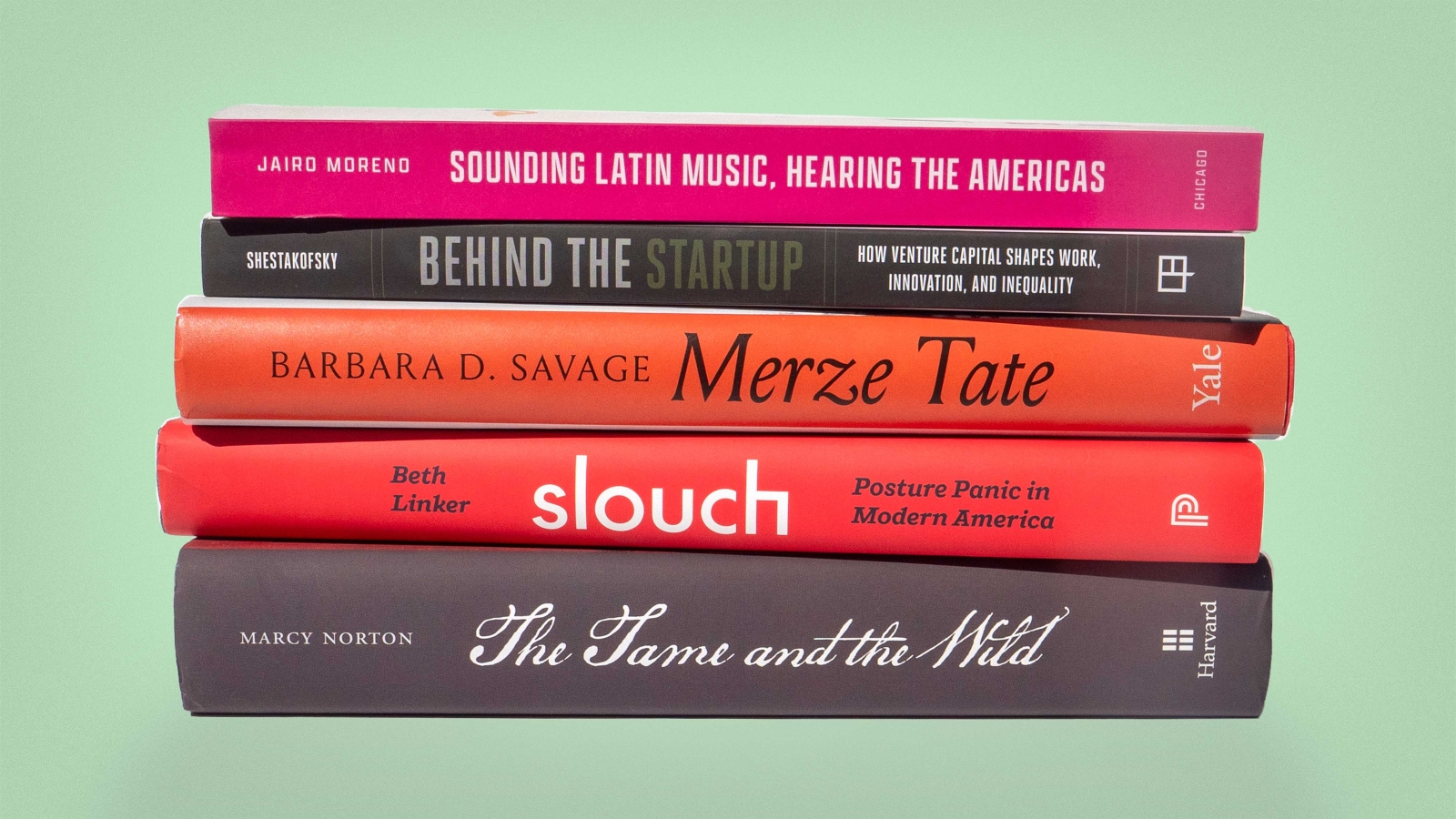 A stack of books on a light green background. The books read, from top to bottom: "Jairo Moreno: Sounding Latin Music, Hearing the Americas", "Shetakofsky: Behind the Startup; how venture capital shapes work, innovation, and inequality", "Beth Linker: slouch; Posture Panic in Modern America", and "Marcy Norton: The Tame and the Wild".